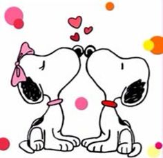 two dogs are kissing each other with hearts floating around the dog's head and nose