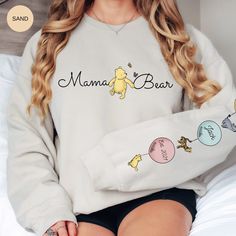 NO RETURNS WILL BE ACCEPTED FOR THIS CUSTOM ORDER UNLESS DAMAGED UPON RECEIPT Customized mama bear Gildan 18000 Sweatshirt that can be used while outside in the cold or when inside and want that extra warmth. Stay stylish and fresh while keeping yourself cozy in this Winnie the Pooh mom sweatshirt that shows your love! Add some novelty to your everyday in your personalized mom life pooh bear sweater. Need that special something for that special someone? This sweatshirt makes the perfect gift, ge Winnie The Pooh Hoodie, Classic Pooh Bear, Aunt Sweater, Mama Bear Sweatshirt, Aunt Sweatshirt, Classic Pooh, Bear Sweatshirt, Bear Sweater, Auntie Shirts