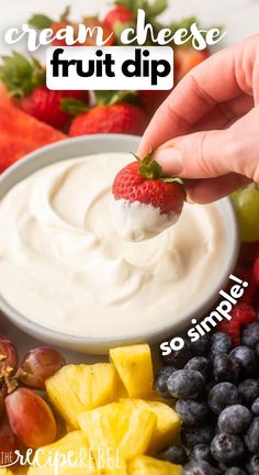 a person dipping fruit into a bowl with the words cream cheese fruit dip above it