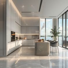 a modern kitchen with large windows overlooking the water