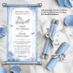 blue and white wedding stationery with silver bells, ribbon and bow on marble background