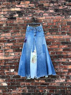 INCREDIBLE patchwork denim skirt from the 1970s made with orange tab LEVIS denim jeans.  Label: LEVIS Measurements: waist: 28" maybe 28.5" hips: 38" length: 42" approx (uneven hem) Condition: some loose patches, a few tears, wear to hem etc as clearly seen. being sold AS FOUND. *ALL SALES CONSIDERED FINAL -vintage is sold in "as-is" / "as-found" condition. we try to mention as best as possible any flaws noted but most of what we sell in this shop is workwear and worn in clothing that shows flaws Jeans Into Skirt, Refashion Jeans, Creating Clothes, Denim Upcycle, Jeans Label, Upcycling Clothes, Denim Clothes, Patchwork Denim Skirt, Long Jean Skirt