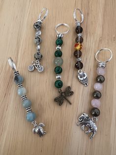 several different types of beads and charms on a table