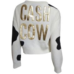 A fabulous whimsical off white and black cashmere sweater from Moschino Couture. It has long sleeves, a crew neckline and CASH COW emblazoned in gold capital letters individually appliqued onto the back of the cow hide pattern sweater. It slips on over the head. Fits sizes Small, Medium. Bust 40" Sleeves 26" Length 19" Moschino Clothes, White Cashmere Sweater, Cash Cow, Black Cashmere Sweater, White Long Sleeve Sweater, Gray Cashmere Sweater, Moschino Couture, Cow Shirt, Clothing Sweaters