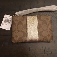 Brown Coach Wristlet New With Tags And Unused, The Front Has A Gold Metallic Detail Down The Middle. Coach Gold Rectangular Wristlet, Gold Rectangular Coach Wristlet, Elegant Gold Coach Wristlet, Coach Gold Clutch Wristlet, Gold Coach Clutch Wristlet, Coach Gold Wristlet For Everyday Use, Gold Coach Wristlet For Everyday, Leopard Print Boots, Brown Coach