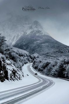 a car driving down a snow covered road in front of a snowy mountain with the words patagonia written on it