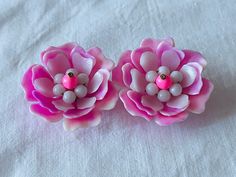 A pair of larger vintage 1950s period pink flower shaped plastic ear clips with metal clips. Clip on Size: 4cm / 1.57" Pink Flower Clip-on Earrings For Wedding, Vintage Clip-on Flower Earrings, Pink Flower Clip-on Earrings, Vintage Gold Flower Clip-on Earrings, Pink Flower-shaped Clip-on Earrings, Embroidered Table Runner, Rose Vintage, Retro Earring, Flower Shape