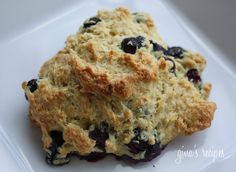 two blueberry scones on a white plate