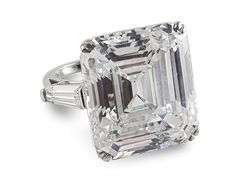 an emerald cut diamond ring with baguetts