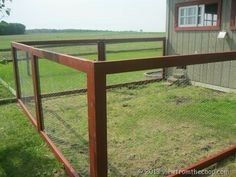 a wooden fence in front of a house