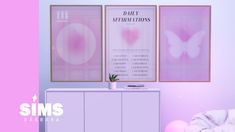 there is a pink room with posters on the wall and a white cabinet in front of it