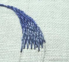 blue thread is being stitched onto the fabric