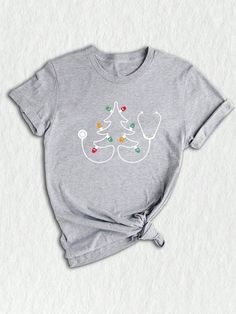 Celebrate the holiday season with our "Christmas Nurse Stethoscope Shirt." This festive design is perfect for nurses, doctors, and paramedics who want to add a touch of holiday spirit to their work attire. The shirt features a stethoscope adorned with Christmas-themed elements, making it a great choice for medical professionals during the Christmas season. Whether you're working at the hospital or attending a medical-themed holiday gathering, this Christmas Stethoscope Tee is sure to bring some cheer. It also makes an excellent Christmas gift for nurses, doctors, or paramedics who deserve some holiday appreciation. Get into the festive spirit with this unique Christmas Doctor Gift.Christmas Nurse Stethoscope Shirt, Christmas Doctor Nurse Paramedic Shirt, Christmas Stethoscope Tee, Christma Doctor Christmas Shirts, Paramedic Christmas Shirt, Funny Nurse Shirts Christmas, Nurse Christmas Shirts, Womens Christmas Shirts Nurse, Pediatric Nurse Christmas Shirts, Staff Shirts, Christmas Nurse Shirts Sublimation, Holiday Nurse Shirt