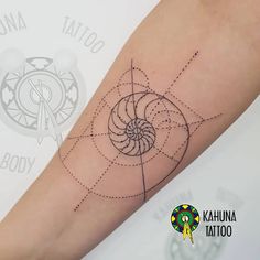 a woman's arm with a tattoo on it that has an image of a spiral