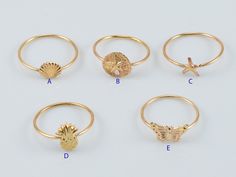 Gold Filled Beach Theme Ring Sizes available: 6, 7, 8 Styles available: Seashell, sand dollar, starfish, pineapple and butterfly Style: A: 6mm x 8mm B: 9mm x 10mm C: 8mm x 8mm D: 10mm x 7mm E: 11mm x 12mm Priced per piece Gold Midi Rings As A Gift For Summer, Gold Midi Rings As Summer Gift, Summer Beach Jewelry Ring, Beach Summer Jewelry Ring, Gold Ocean-inspired Rings For Beach, Summer Beach Ring Jewelry, Handmade Gold Rings For The Beach, Handmade Gold Rings For Beach, Adjustable Midi Rings For Beach