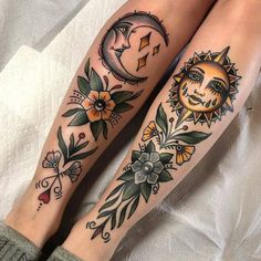 two sun and moon tattoos on both legs, one with flowers in the foreground