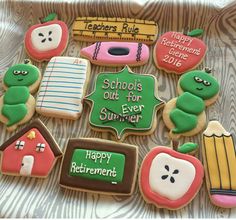 some decorated cookies are sitting on a table with the words school is out for summer