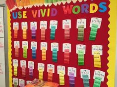 a bulletin board that has some words written on it and colorful crayons attached to the boards