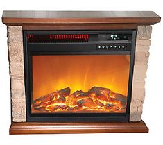 an electric fireplace heater with logs burning