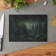 a knife and some plants on a table