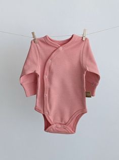 Long Sleeve Cotton Onesie With Buttons, Cotton Long Sleeve Onesie With Buttons, Cotton Long-sleeve Onesie With Buttons, Solid Cotton Long Sleeve Bodysuit, Long Sleeve Solid Cotton Bodysuit, Solid Long Sleeve Cotton Bodysuit, Fall Cotton Long Sleeve Bodysuit, Long Sleeve Onesie For Loungewear, Winter Long Sleeve Cotton Bodysuit