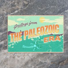 a sticker that reads greetings from the paleozic era on a marble surface