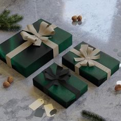 three wrapped presents sitting on top of a table