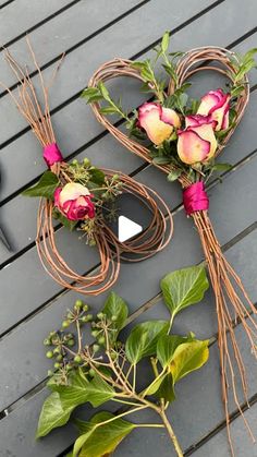 some flowers are laying out on the ground next to each other, and one is tied up with twine