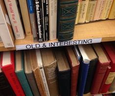 an old and interesting book shelf filled with books