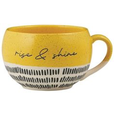 a yellow and white coffee cup with the words rise & shine on it's side