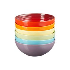 five colorful bowls stacked on top of each other with one empty bowl in the middle