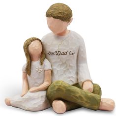 a ceramic figurine of a man and woman sitting next to each other on the ground