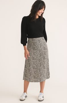 Move easily from work to weekend in this versatile midi skirt crafted from lightweight fabric and covered in a lively print. Hidden side-zip closure 100% Tencel® lyocell Tencel lyocell is a more-sustainably produced fiber made with closed-loop processing Machine wash, tumble dry Imported Viscose Lined Skirt For Work, Lined Viscose Skirt For Work, Spring Workwear Rayon Skirt, Rayon Skirt For Workwear In Spring, Marine Layer, Printed Midi Skirt, Lightweight Fabric, Side Zip, Midi Skirt