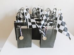 black and white checkered paper bags with medals on them