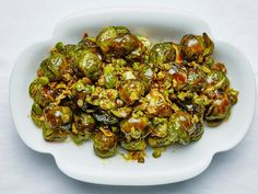 brussel sprouts are in a white bowl