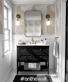 a bathroom with floral wallpaper and two sinks