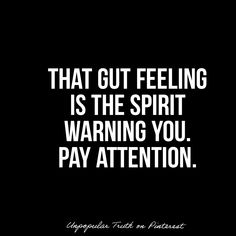 a black and white photo with the words that gut feeling is the spirit warning you pay attention