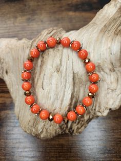 Fall is my favorite time of year and this bracelet just screams Pumpkin patch, autumn leaves, pumpkin spice, and festive feels! . While we aren't quite to Fall 2023 yet, loading up on some one of a kind, handmade, Autumn accessories early, is only going to make you that much more ready to spice up your look when you finally do bust out the leggings and warm comfy sweaters.  . These bright orange glass beads make this bracelet pretty bold! Then the sparkling brown beads and the brass spacers incorporate a beautiful Fall feeling into this festive piece! . Spiritual Orange Stretch Bracelet, Autumn Beaded Bracelet, Elegant Orange Bracelet, Pumpkin Bead Bracelet, Orange Artisan Hand-strung Bracelets, Bohemian Orange Hand-strung Bracelets, Adjustable Nickel-free Orange Bracelets, Adjustable Nickel-free Orange Bracelet, Fall Bead