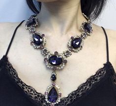 Elegant Long Crystal Necklaces, Elegant Long Crystal Necklace, Elegant Amethyst Jeweled Necklaces, Elegant Amethyst Jewel Necklace, Crystal Long Necklace For Wedding, Purple Pendant Jewelry For Party, Evening Rhinestone Necklace With Jewels, Glamorous Crystal Necklace As A Gift, Jeweled Pendant Jewelry For Evening