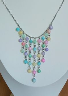 This pretty waterfall necklace is made with shell beads that have been dyed an array of pastel colours.  The chain and connections are all stainless steel.  This necklace measures 20 inches in length. Pretty Waterfall, Waterfall Necklace, Pastel Colours, Shell Beads, Beaded Necklaces, Pastel Colors, Norway, Necklace Etsy, Shells