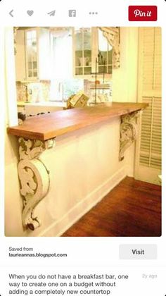 an image of a counter top in the middle of a room with wood flooring