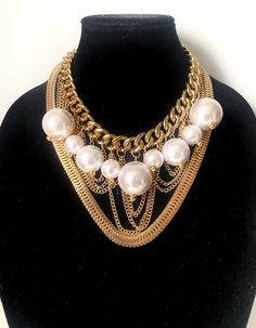 Multi Layer Chunky Chain With Big Pearls a striking blend of urban edge and classic elegance. This multi-layered piece features bold gold chains adorned with clusters of lustrous white big acrylic pearls, creating a dramatic and trendy look. Perfect for adding a touch of sophistication to any outfit, this necklace is a must-have for the modern fashionista who loves to make a statement. Material: acrylic pearls, curb chain acrylic The necklace measures: 17" +4" (43 cm+10cm) Available in silver ht Layered Pearls, Chain With Pearls, Big Pearl Necklace, Chunky Pearls, Urban Fashion Women, Big Pearl, Women Necklace, Bridesmaid Necklace, Multi Strand Necklace