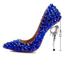 A classic but stylish crystal studded reinterpretation by the Pisani Maison. Vivid and ever changing tonality of colour define this unique piece. Full crystal stiletto with clinging seahorse. Inner lining. Genuine leather sole. Heel: 120 mm. [custom tab]UPPER #1: 100% GOAT LEATHER | UPPER #2: 100% COW LEATHER | INSERT #1: 100% GLASS FIBRE | OUTSOLE #1: 100% COW LEATHER [/custom tab] Blue Glitter Heels, Grad Shoes, Heels Sparkly, Rhinestone Wedding Shoes, Rhinestone Pumps, Unique Heels, Heels Wedding, Rhinestone High Heels, Christmas Shoes