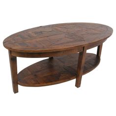 an oval wooden table with two shelves on each side and one shelf below the coffee table