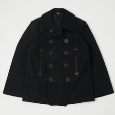 As a part of their very special collection with novelist William Gibson, Buzz Rickson’s have released a beautifully crafted, pre-WWII style pea coat in jet black. Based on an archival piece from the early 20th Century, this coat is cut from a heavyweight 36 oz. melton wool which has been expertly created on vintage machinery, and has been lined with a luxuriously soft rayon satin blend. Boasting a rigid, high-collar this piece has been specially designed to protect your neck from the arctic wind Buzz Rickson, Navy Pea Coat, William Gibson, Clothing Factory, U S Navy, Clothing Tags, Pea Coat, Clothing Co, Jet Black