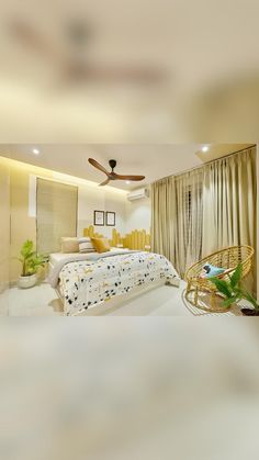 a bedroom with a bed, chair and ceiling fan in the room that is very clean