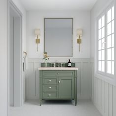 a bathroom with a green vanity and white walls