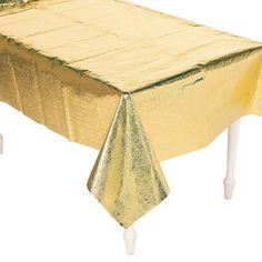 a gold table cloth with white legs