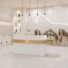 a white and gold reception area in a modern style building with art work on the walls