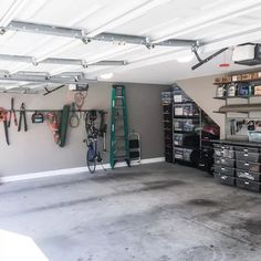 a garage filled with lots of tools and hanging on the wall next to each other